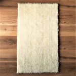 Covor decor - fir lung, 60 cm x100 cm, antiderapant, 100% fibre sintetice, ivoire